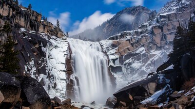 Snowy Waterfall in Mountain Canyon