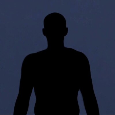 Silhouette of bald man facing away