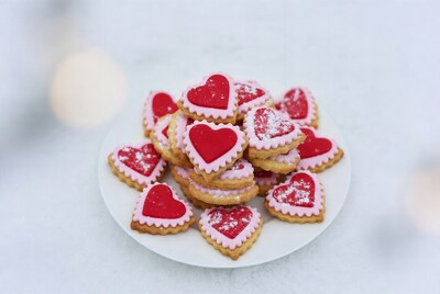 Stack of heart-shaped cookies on plate