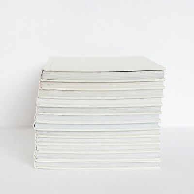 Stack of white notebooks