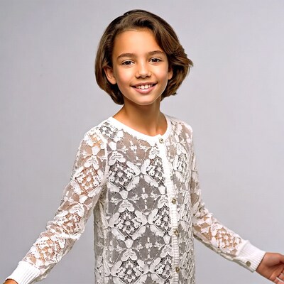 Girl in white lace dress smiling