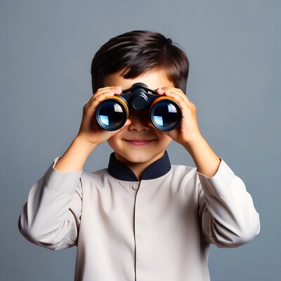 Boy looking through binoculars