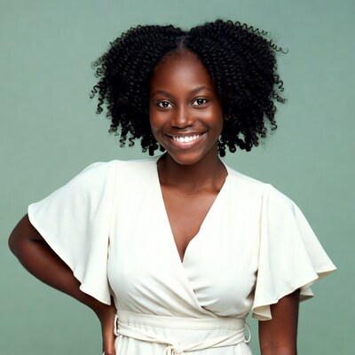Smiling African-American woman in white dress