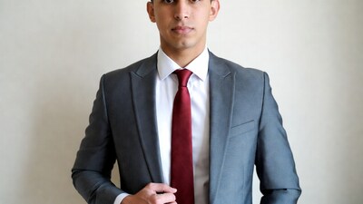 Man in gray suit with red tie