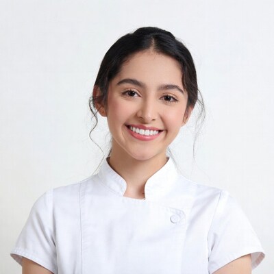 Smiling Asian woman in white uniform