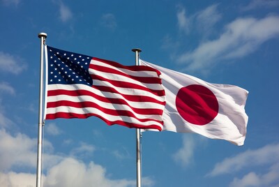 US and Japanese Flags Waving