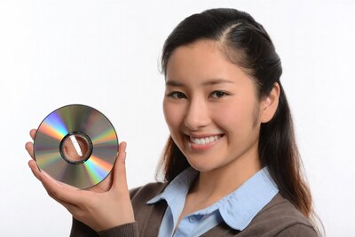 Asian woman holding CD disc