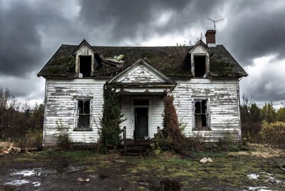 Abandoned White House in Stormy Weather