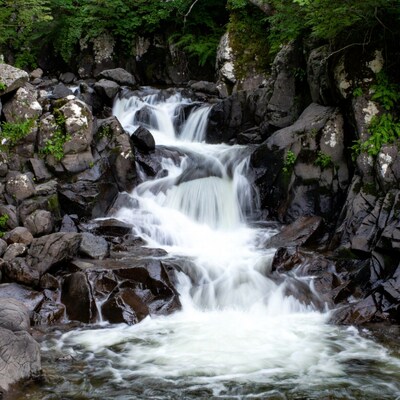 Waterfall cascading over mossy rocks