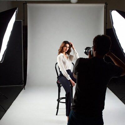 Woman Posing for Photographer in Studio