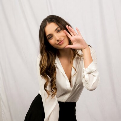 Woman making peace sign gesture