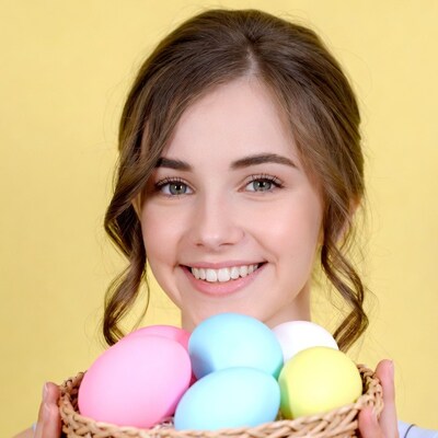 Woman holding colorful Easter eggs