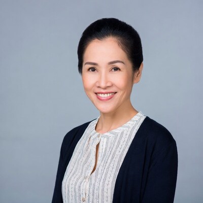 Asian woman smiling in business attire