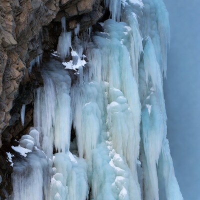 Icicles Hanging on Rocky Cliff
