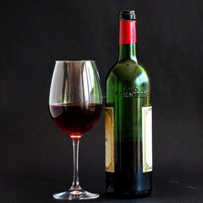 Red wine glass and bottle