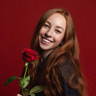 Girl holding red rose