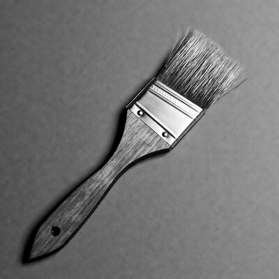 Paintbrush on gray background