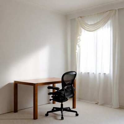 Empty office desk with ergonomic chair