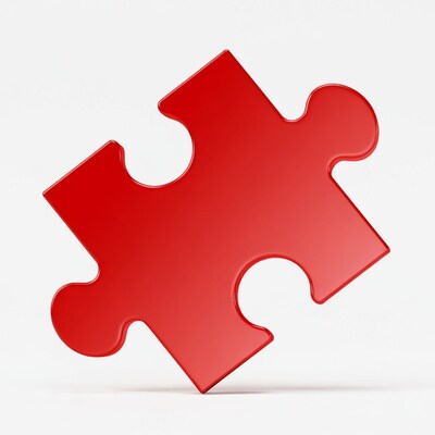 Red puzzle piece on white