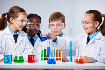 Children in lab coats doing science experiment
