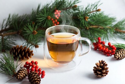Hot Tea in Glass Mug with Christmas Decor