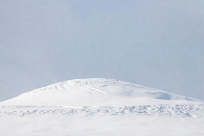 Snowy mountain under blue sky