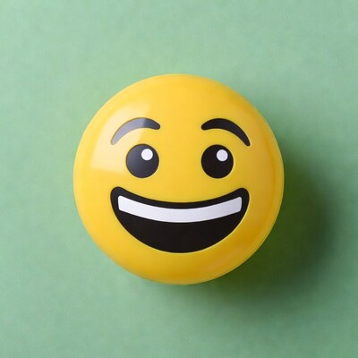 Grinning yellow emoji on green background