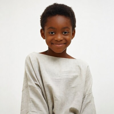 Smiling African boy in linen shirt