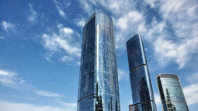 Modern glass skyscrapers against blue sky