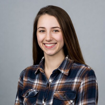 Smiling teenage girl in plaid shirt