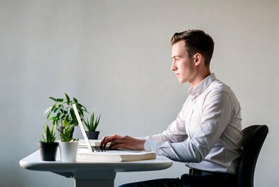 Man working on laptop at desk
