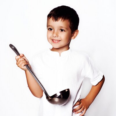 Boy holding ladle