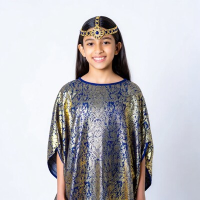 Indian girl in gold headpiece and blue dress