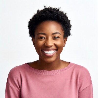 Smiling African-American woman in pink sweater