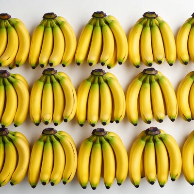 Ripe bananas arranged on white background