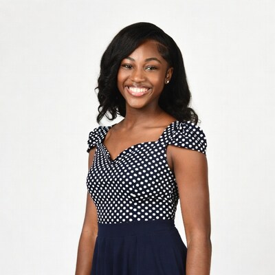 Smiling African-American woman in polka dot dress