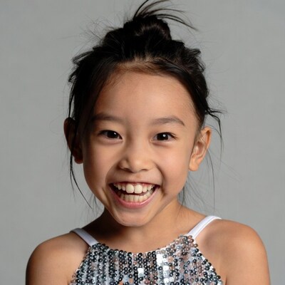 Asian girl smiling in sequin dress