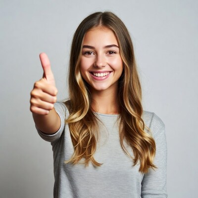 Young woman giving thumbs up