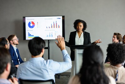 African-American woman presenting charts to audience