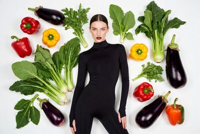 Woman surrounded by vegetables