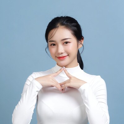 Asian woman making heart hands