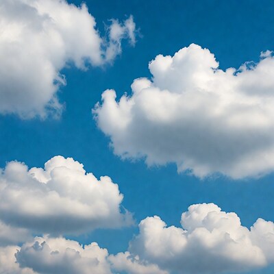 Fluffy white clouds in blue sky