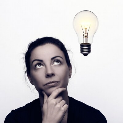 Woman thinking with lightbulb