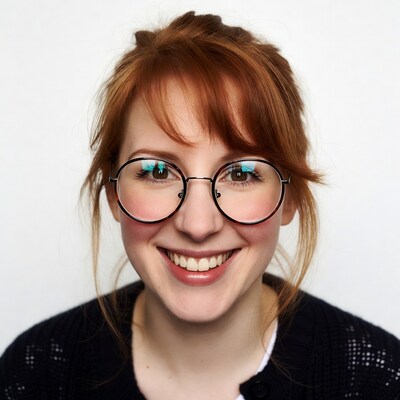 Smiling redhead woman in glasses