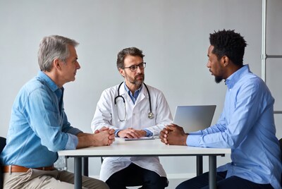 Doctor consulting two male patients