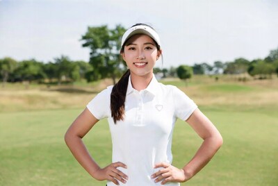 Asian woman golfer on green