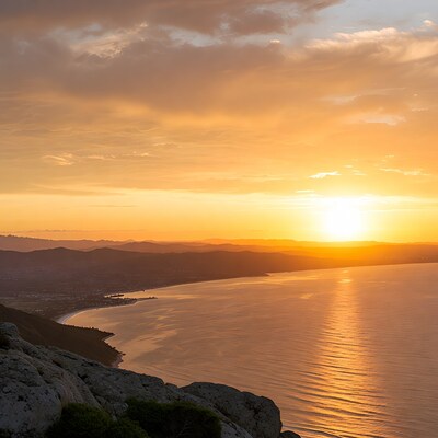 Sunset over ocean and mountains
