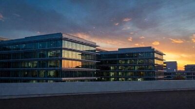 Modern glass office buildings at sunset