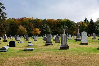 Autumn Cemetery with Gravestones and Trees