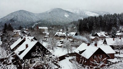 Snowy Alpine Village with Mountains